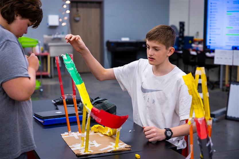 Students build paper rollercoasters